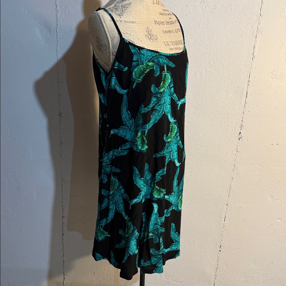 Elegant Black Dress with Green Leaf Pattern